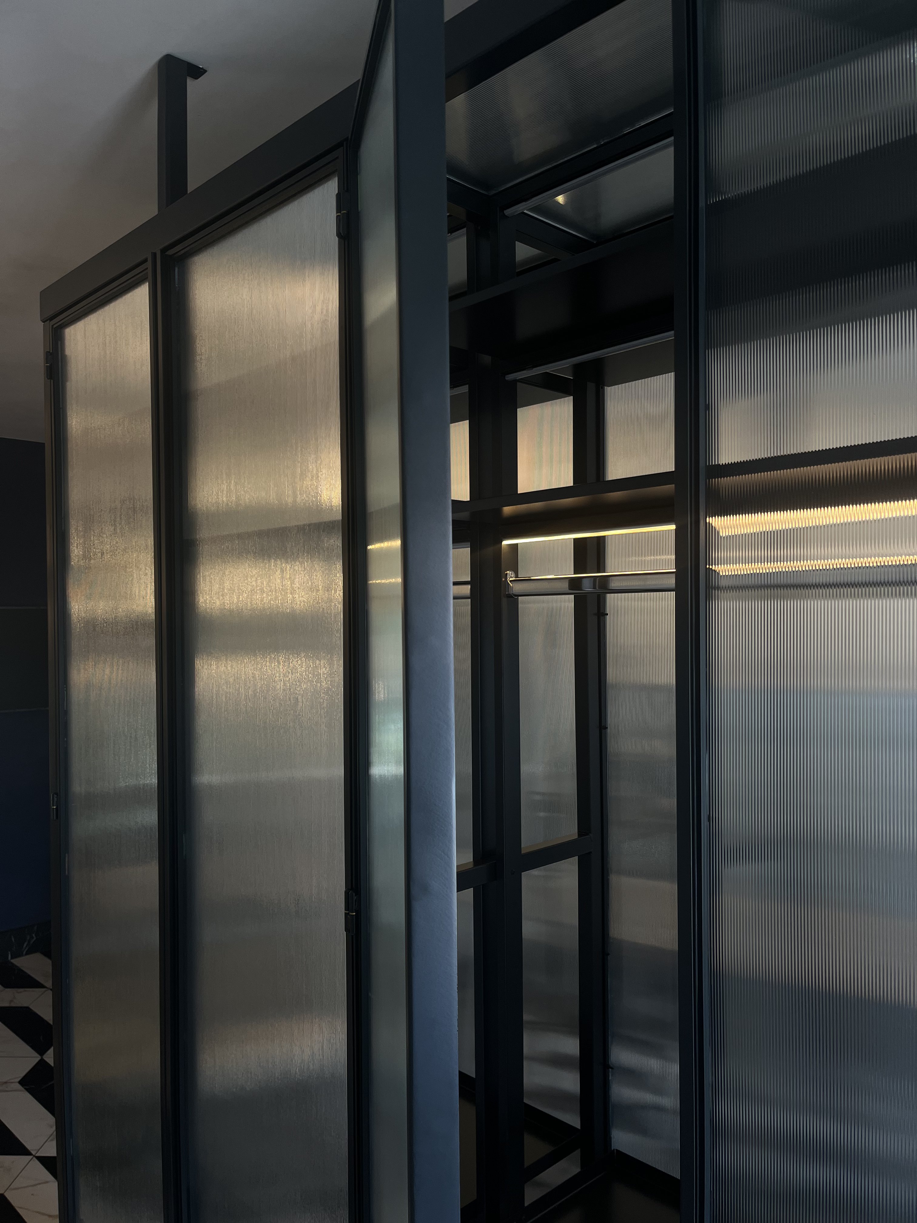 Steel-framed glass wardrobe with integrated lighting - finished photograph 9