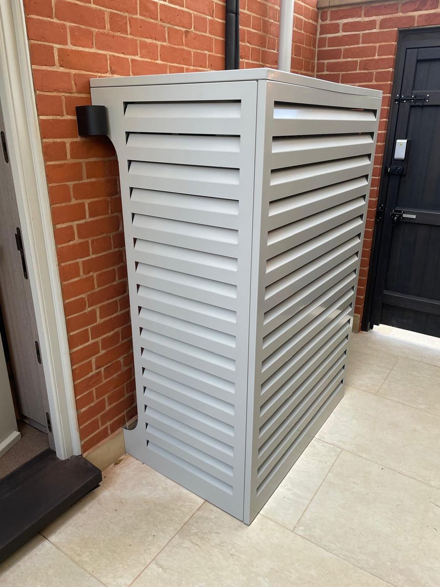 Finished louvred air conditioning enclosure installed
