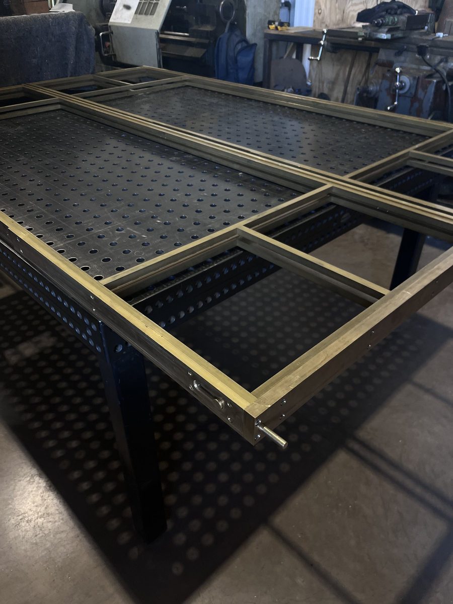 Brass door frame on the workshop table