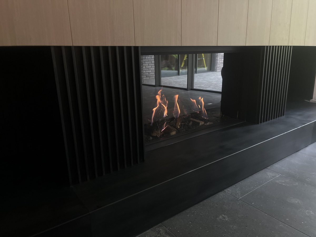 Finished blackened steel fireplace