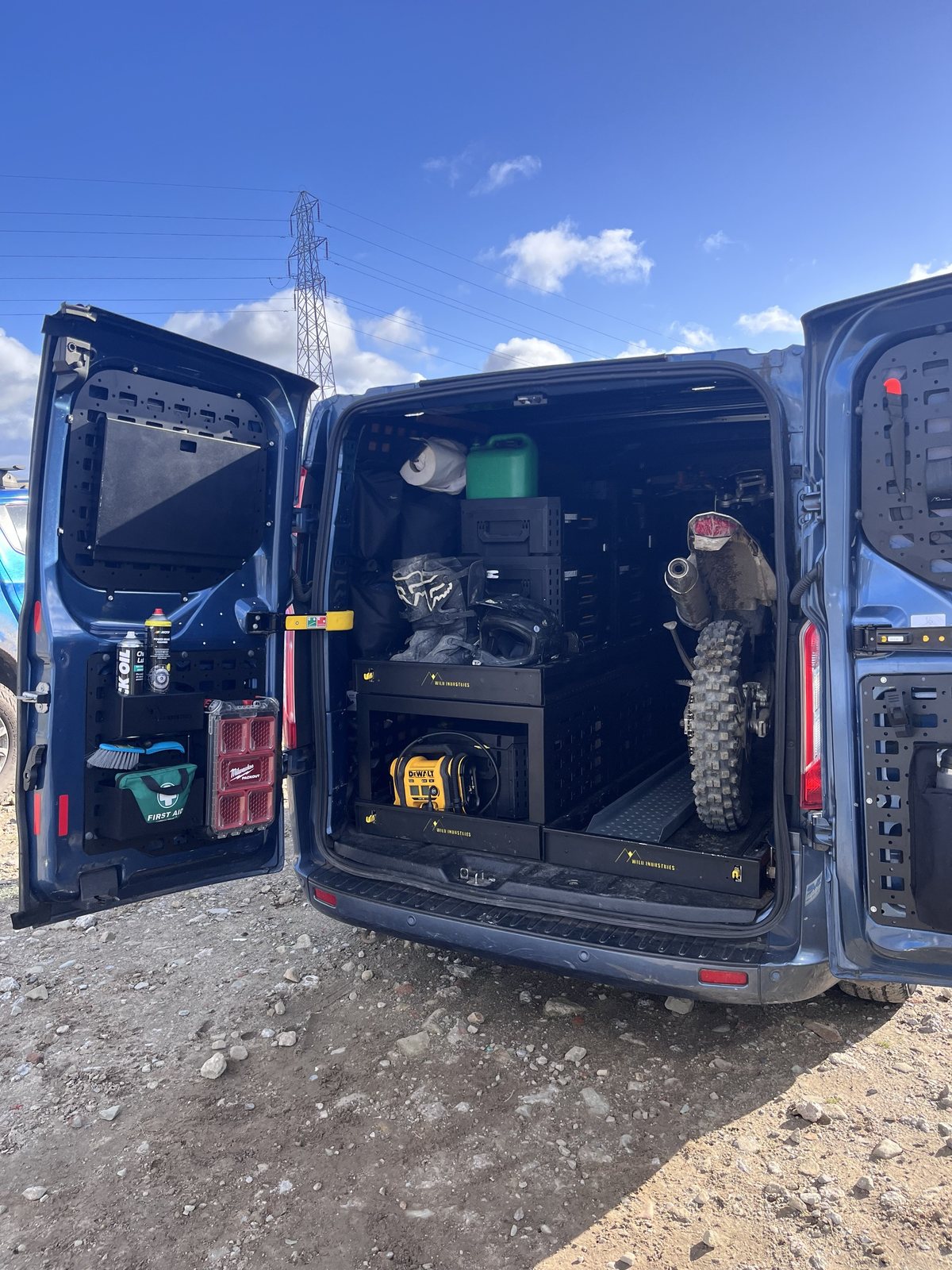 Drawer system fitted in a van, set up to carry a dirt bike and kit